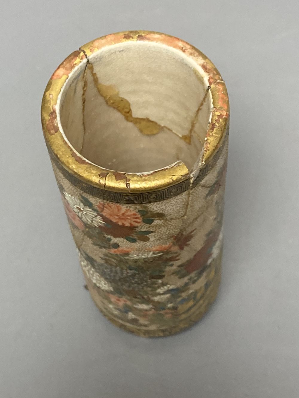 A Japanese satsuma brush pot (a.f.), a similar cloisonne vase and a porcelain tile, tallest 18cm